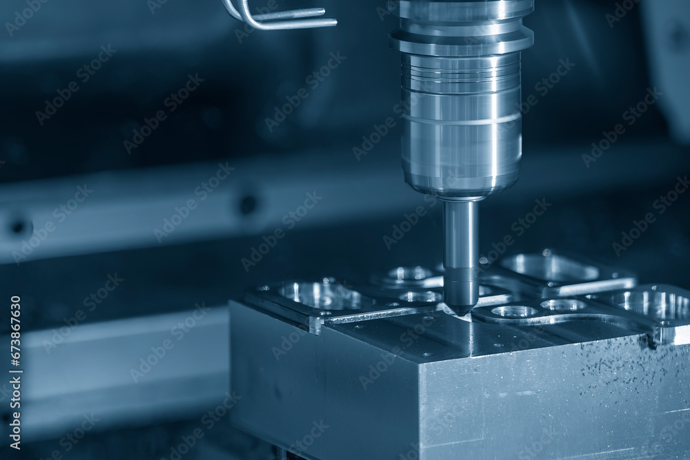 The CNC milling machine chamfer cutting mold base part by chamfer tool in the light blue scene. The CNC milling machine chamfer cutting mold base part by chamfer tool in the light blue scene.