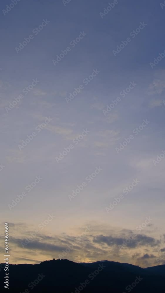 Twilight and dawn sky with cumulus cloud vertical time lapse in an evening. Twilight and dawn sky with cumulus cloud vertical time lapse in an evening.