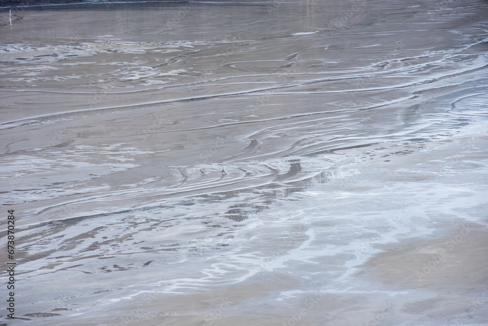 Muddy waters in a decantation pond. Toxic residuals from a copper mine decating in a settling basin Muddy waters in a decantation pond. Toxic residuals from a copper mine decating in a settling basin