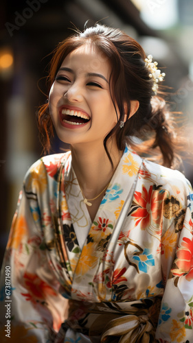 Young Japanese woman in yukata, laughing in bamboo forest.