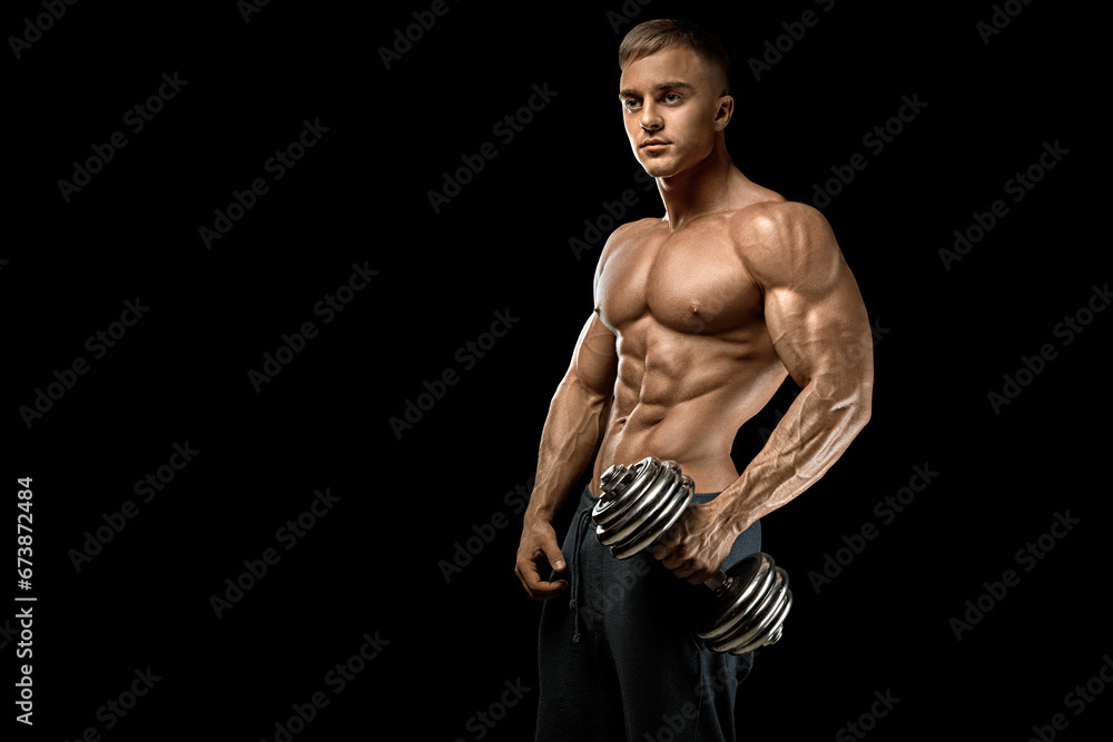 Naklejka premium Young bodybuilder with dumbbell workout