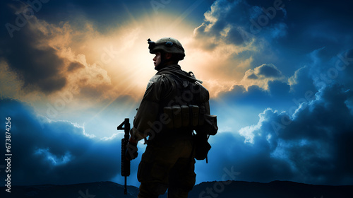 Silhouette of a modern armed soldier against the backdrop of an evening city with the rays of the setting sun and copy space. Concept of border protection, army, memorial day, patriotism.