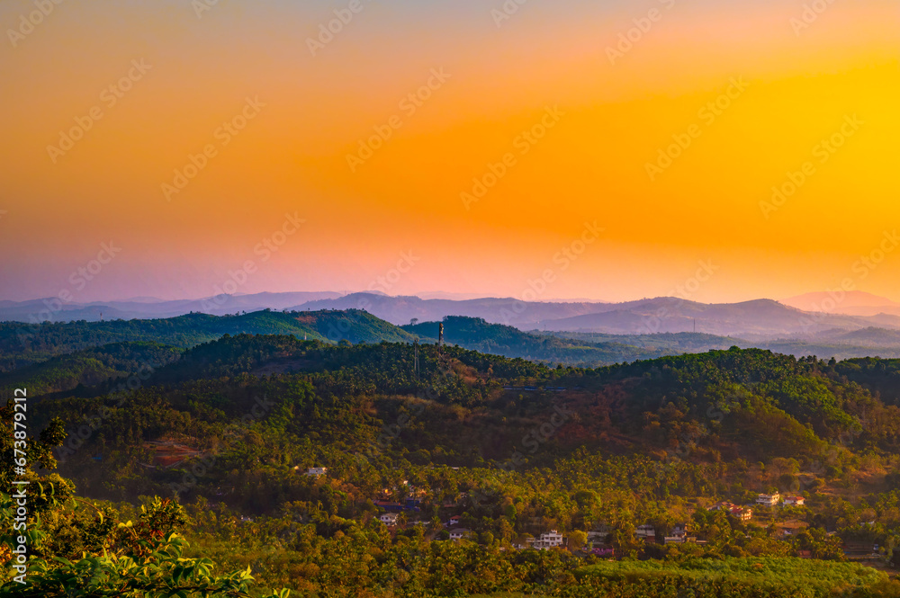 Naklejka premium Beautiful Sunset Mountain landscape from Perinthalmanna, Kerala, India 