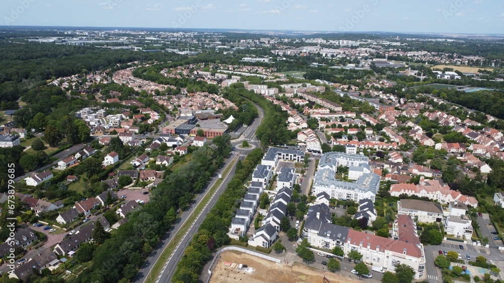 Aerial view of residential houses in a green landscape