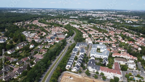 Aerial view of residential houses in a green landscape