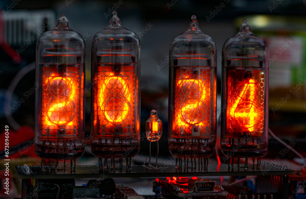 retro Nixie lamp indicator clock on dark background 2024 number retro Nixie lamp indicator clock on dark background 2024 number