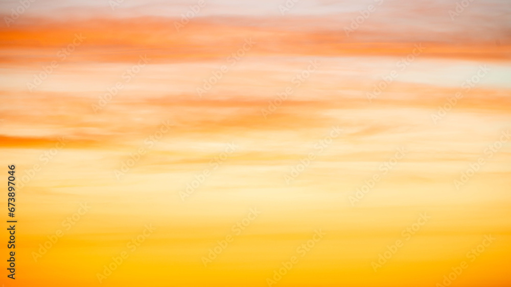Obraz premium The dramatic colors of the sunset in the sky gradient from blue to orange.