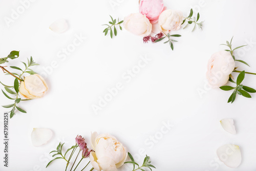 Festive flower rose composition on the white background. Overhead top view, flat lay. Copy space.