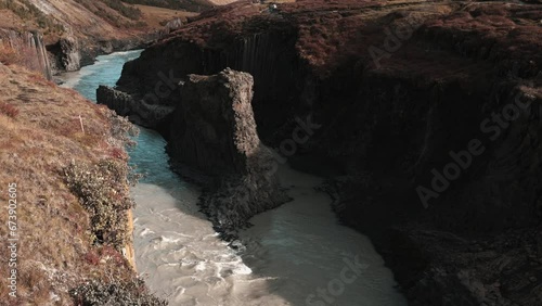 Stuðlagil Canyon, Glacier Valley called Jokuldalur. Largest number of basalt rock columns in Iceland. Jökla River, one of the largest and strongest glacial rivers. 4k stock video. photo