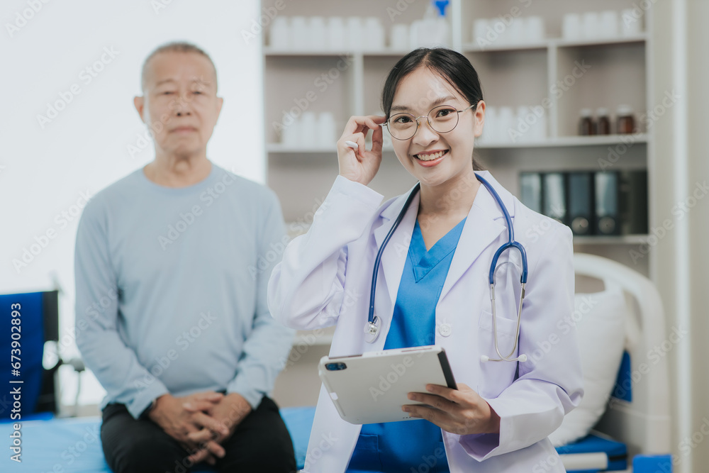 Fototapeta premium Female doctor talking taking care of her senior patient give support Doctor helping elderly patient with Alzheimer's disease A female attendant holds the hand of an elderly man