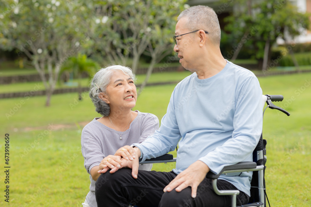 Senior couple taking care of each other in the park Senior couple taking care of each other in the park