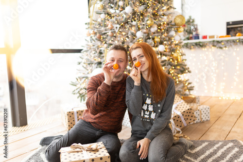 couple near the Christmas tree. the winter vacation. Christmas morning family celebrations