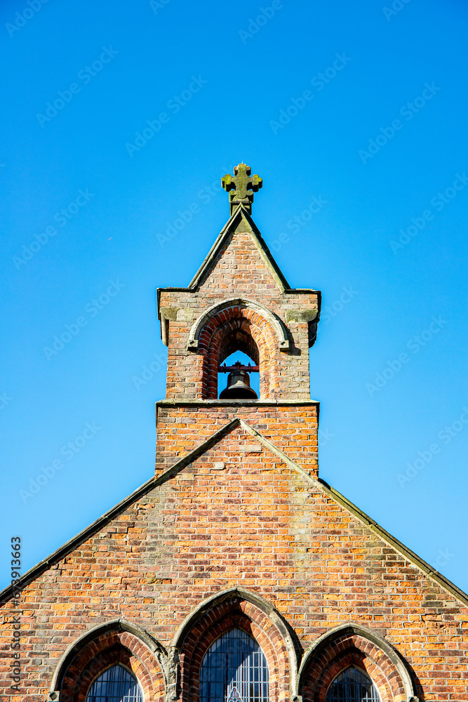 Fototapeta premium Church bell tower with cross UK