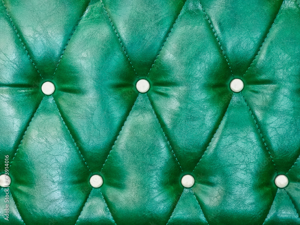 Green sofa leather surface.