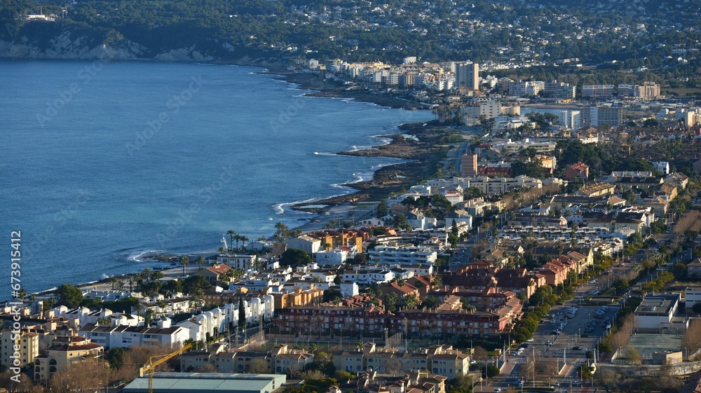 Aerial view of a scenic shore with buildings in Xabia, Spain