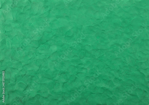 Green plasticine texture background. Modeling clay material pattern.