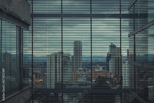 Bogota seen through a blind on a window photo