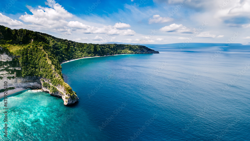 Obraz premium Drone Shot of an Island and Deep Sea