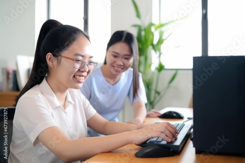 Happy Asian women co-workers in office workplace including person with blindness disability using computer with refreshable braille display assistive device. Disability inclusion at work,Generative AI © Dream Canvas