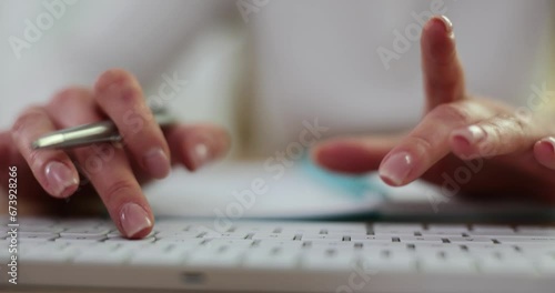 Closeup business women typing hands on computer keyboard to use internet photo