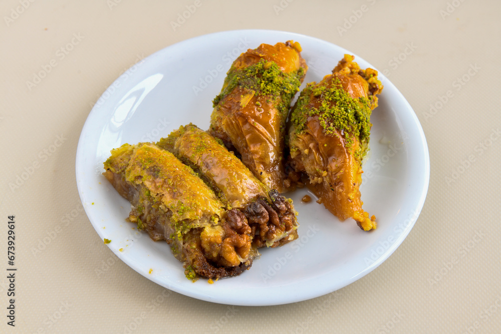 Turkish Dessert Sobiyet  Baklava, kadayif,  mussels baklava and classic baklava with Pistachio . Cevizli, Fistikli Baklava, top view.