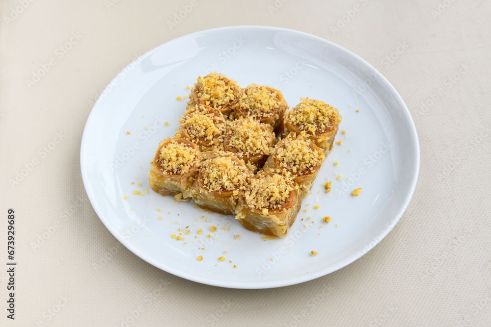 Turkish Dessert Sobiyet Baklava, kadayif, mussels baklava and classic baklava with Pistachio . Cevizli, Fistikli Baklava, top view. Turkish Dessert Sobiyet Baklava, kadayif, mussels baklava and classic baklava with Pistachio . Cevizli, Fistikli Baklava, top view.