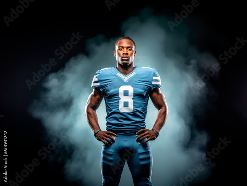 dynamic banner portrait of American football sportsman player in blue uniform on black background with smoke