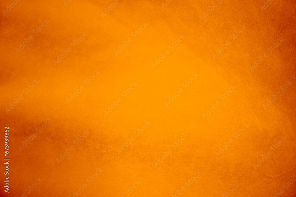 Orange velvet fabric texture used as background. Orange color panne fabric background of soft and smooth textile material. crushed velvet .luxury Orange tone for silk...