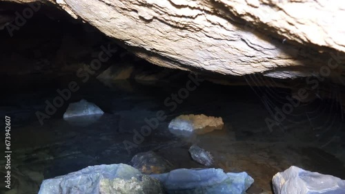 River grotto. A niche in a limestone rock washed out by a spring flood photo