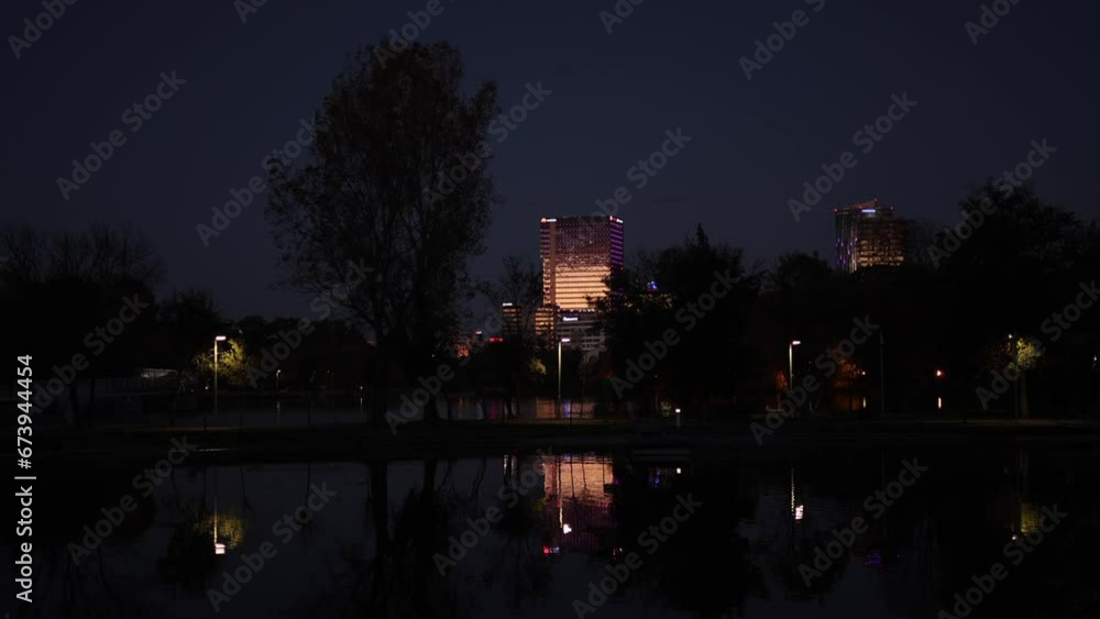 Autumn evening in Bucharest 4k video. Beautiful night view with the skyscraper modern office buildings from the North of Bucharest, Baneasa and Pipera areas landscape over Floreasca Lake. Autumn evening in Bucharest 4k video. Beautiful night view with the skyscraper modern office buildings from the North of Bucharest, Baneasa and Pipera areas landscape over Floreasca Lake.