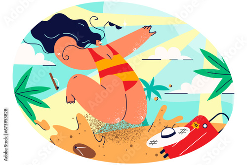 Smiling woman in biking jump on beach