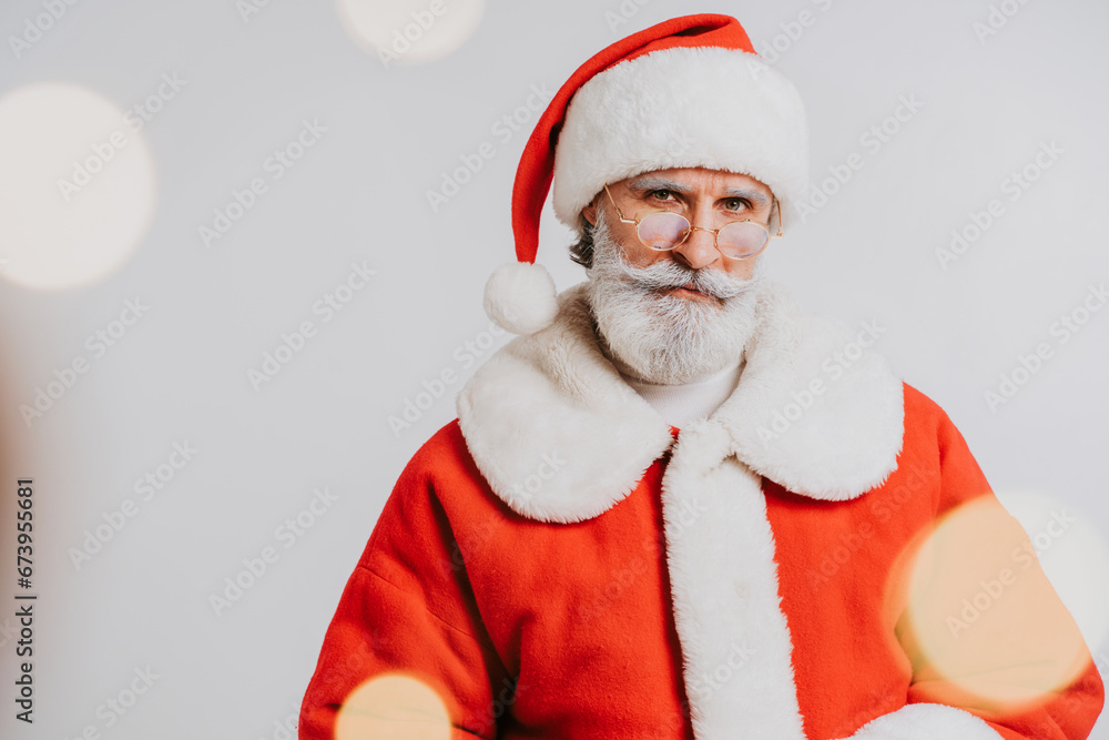 Funny Santa Claus with white beard - Santa Claus portrait with festive costume, Christmas and new year festive days concepts Funny Santa Claus with white beard - Santa Claus portrait with festive costume, Christmas and new year festive days concepts