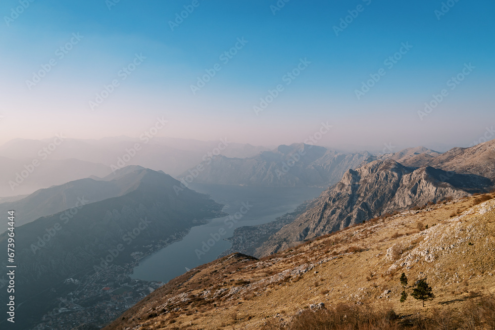 View from the mountain to the valley of the Bay of Kotor and mountains in the fog