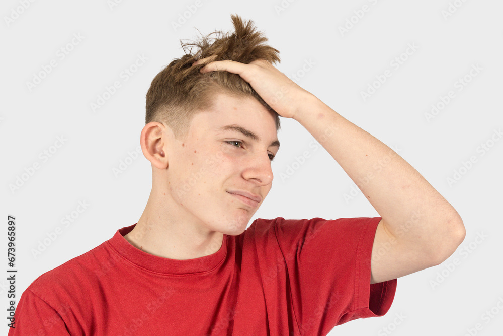 Headshot of an annoyed teenage boy Headshot of an annoyed teenage boy