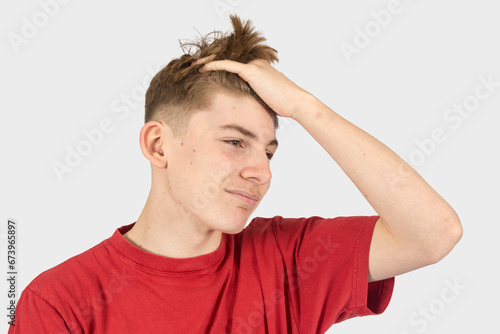Headshot of an annoyed teenage boy