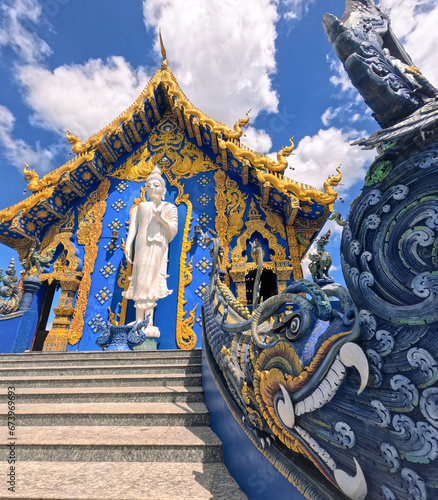 Large Buddha statue on façade of Wat Rong Suea Ten Blue Temple at Chiang Rai Thailand photo