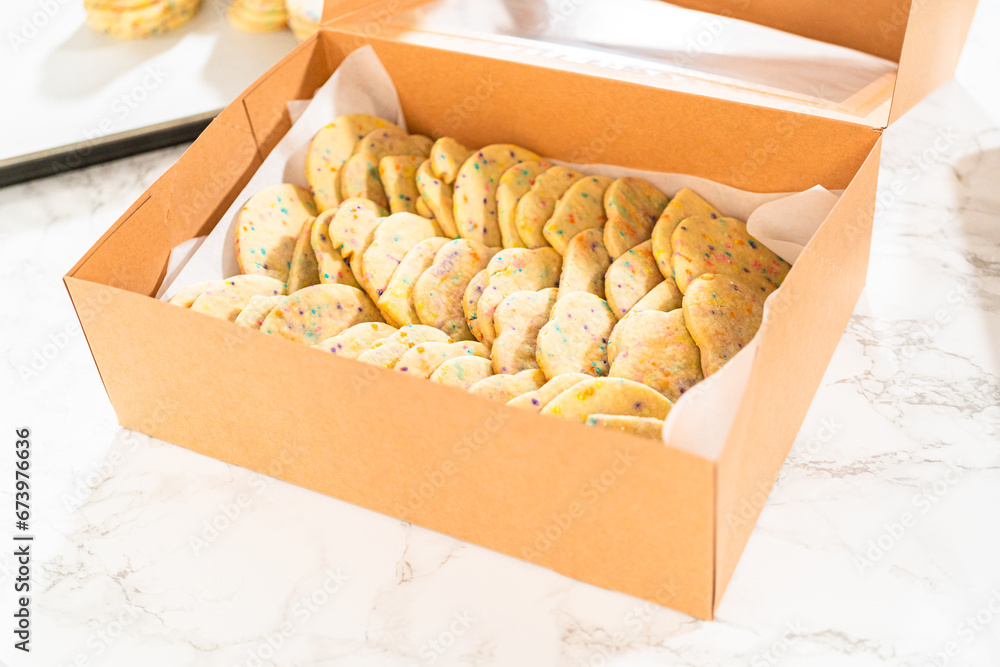 Packing Sprinkle-Adorned Sugar Cookies into Boxes Packing Sprinkle-Adorned Sugar Cookies into Boxes