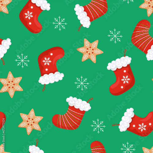 Red Christmas stockings, gingerbread cookies and snowflakes on a green background. Festive seamless pattern. Vector cartoon illustration.