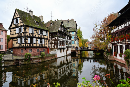 Quaint timbered houses of Petite France in Strasbourg, France. French traditional houses with reflection on river.