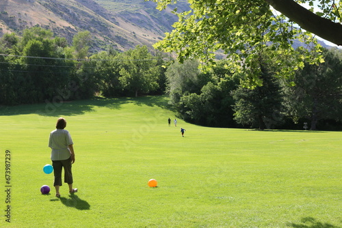 a family playing at the park in provo  photo