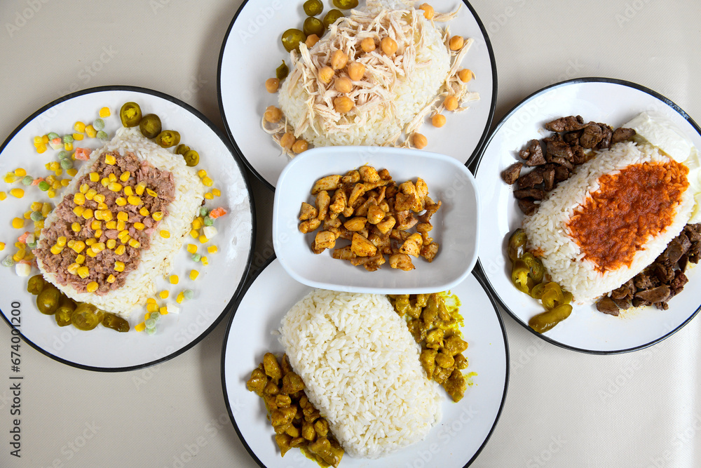 Table scene of assorted take out or delivery foods. Traditional Turkish cuisine. Various Turkish meal and appetizers. Top down view on a table. Table scene of assorted take out or delivery foods. Traditional Turkish cuisine. Various Turkish meal and appetizers. Top down view on a table.