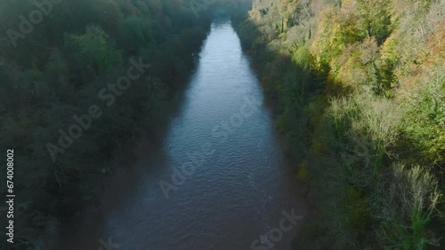 High wide aerial of a river valley in autumn (Wye Valley, UK) photo