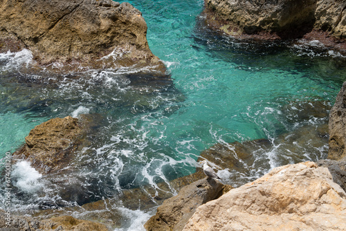 turquoise sea water and rocks on the Mediterranean coast scenic seascape nature background
