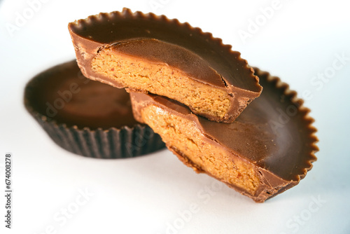 Macro shot of Peanut butter filled candy with chocolate frosting isolated on white background