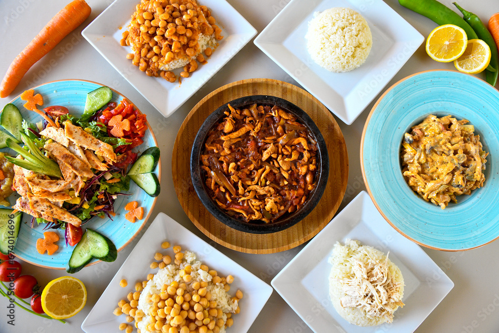 Table scene of assorted take out or delivery foods. Traditional Turkish cuisine. Various Turkish meal and appetizers. Top down view on a table. Table scene of assorted take out or delivery foods. Traditional Turkish cuisine. Various Turkish meal and appetizers. Top down view on a table.