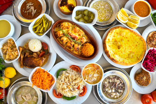 Table scene of assorted take out or delivery foods. Traditional Turkish cuisine. Various Turkish meal and appetizers. Top down view on a table.