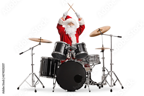 Happy santa claus playing the drums photo