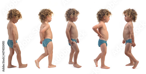 Foto various poses of same boy in underpants walking on white background (3 year old)