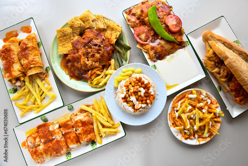 Table scene of assorted take out or delivery foods. Traditional Turkish cuisine. Various Turkish meal and appetizers. Top down view on a table.