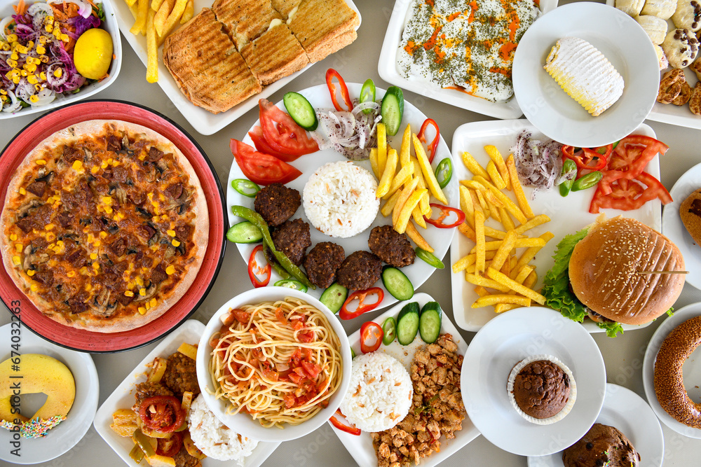 Table scene of assorted take out or delivery foods. Traditional Turkish cuisine. Various Turkish meal and appetizers. Top down view on a table. Table scene of assorted take out or delivery foods. Traditional Turkish cuisine. Various Turkish meal and appetizers. Top down view on a table.